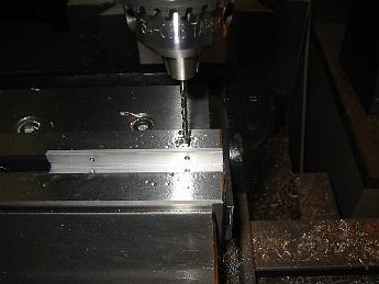  3-Feb-08 Plodding along on the chain gang. Cutting, Drilling, Tapping and finishing the 10 angle-brackets into identical parts is as close to production machine work as I've ever done. It took me a couple of hours to finish them, with plenty of time before the Super Bowl started.